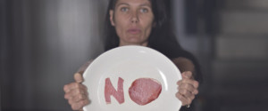 Vegetarian woman demostrates her refusal of meat
